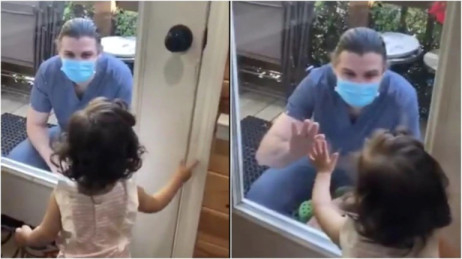 Doctor meets baby girl through glass door as she cries. Viral video has Twitter in tears